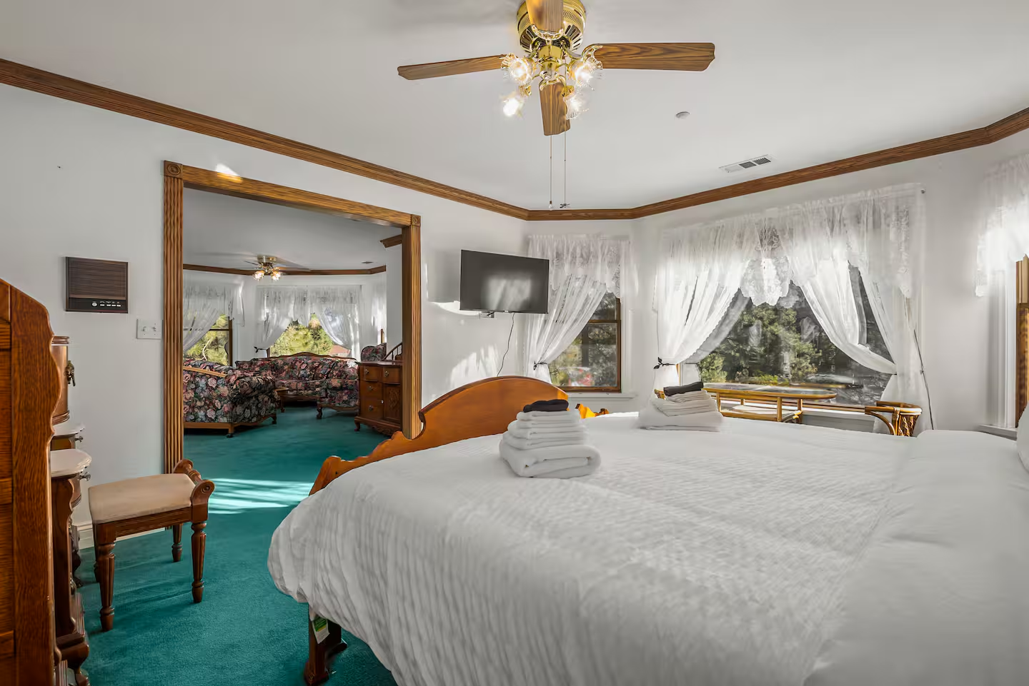 A private resident suite with king bed and bay window